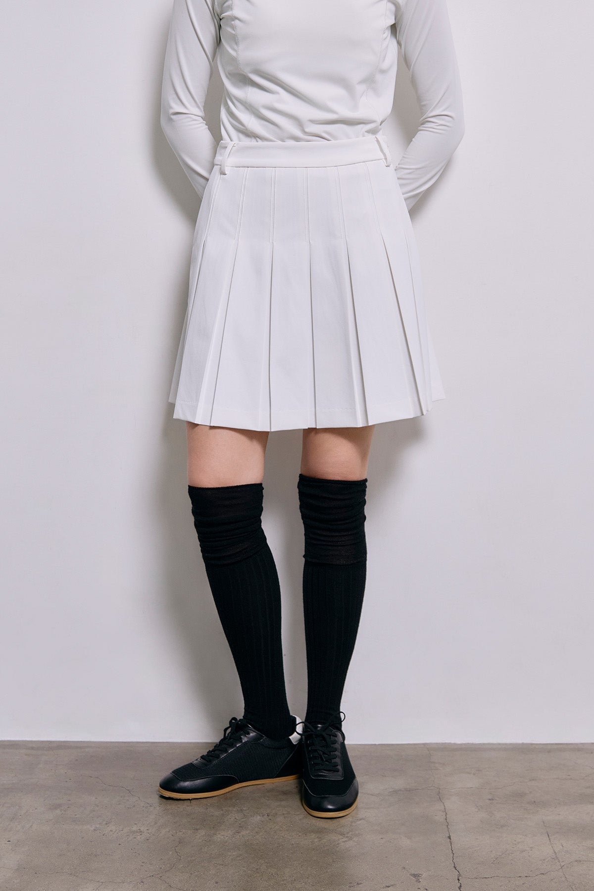 ESSENTIAL GOLF PLEATS SKIRT